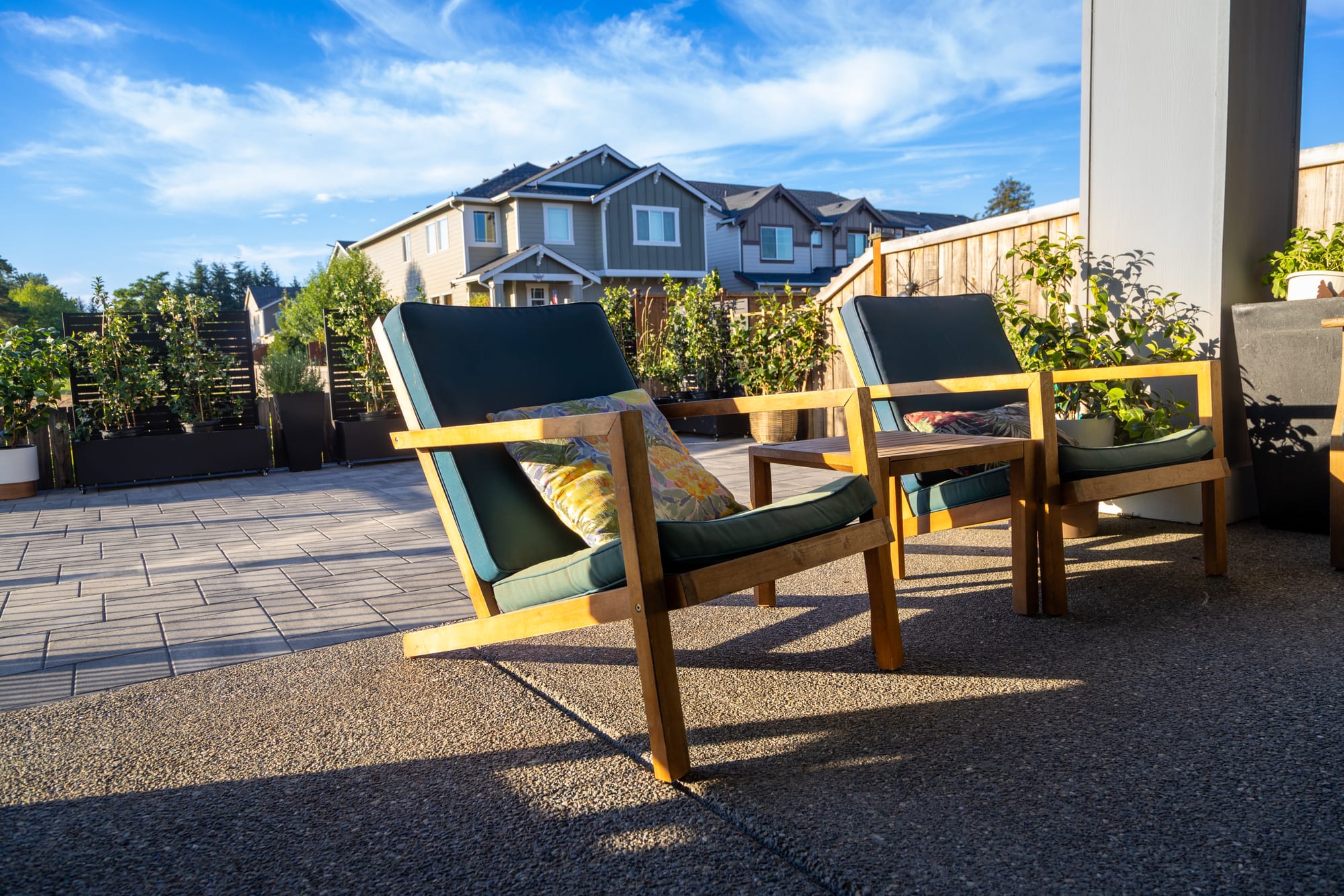 Multi-level backyard with retaining walls and outdoor living built by Father Nature Landscapes