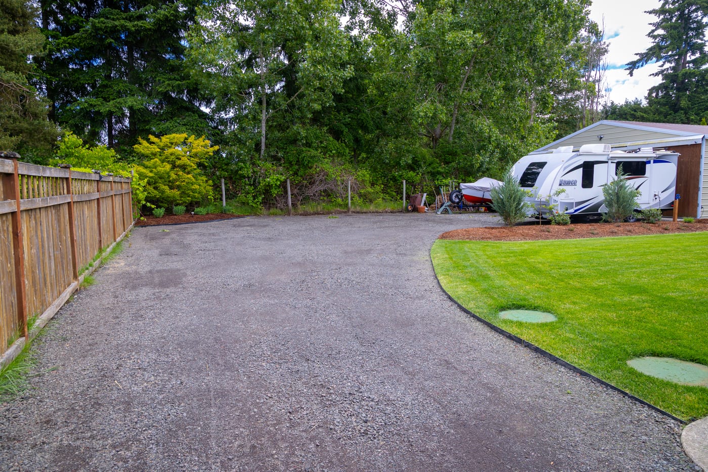 The new Belgard paver driveway with a charcoal sailor-course border