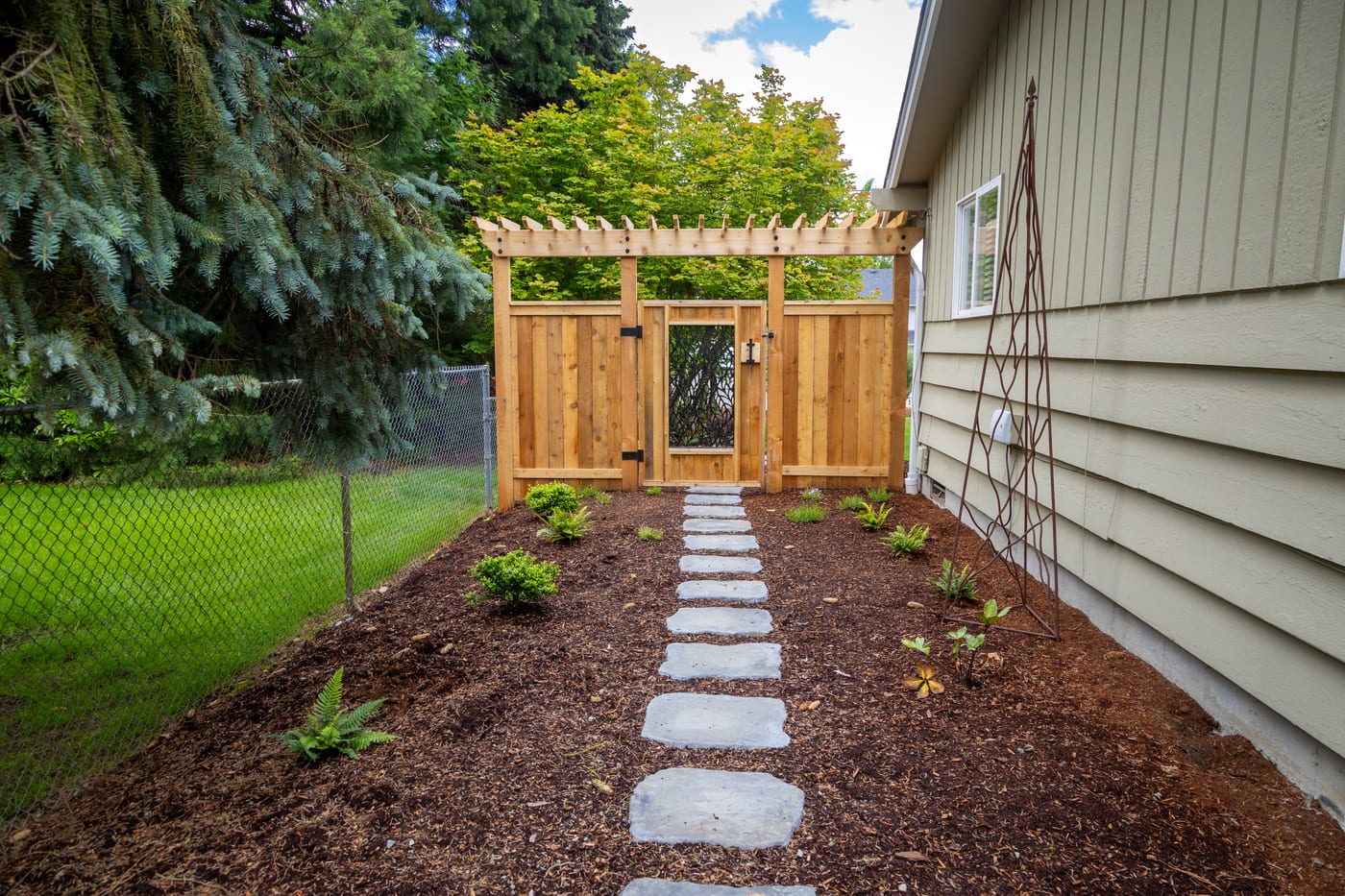 A stepping-stone path through the side garden