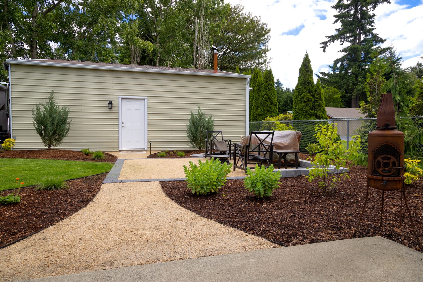 A closer look at the backyard gravel seating area