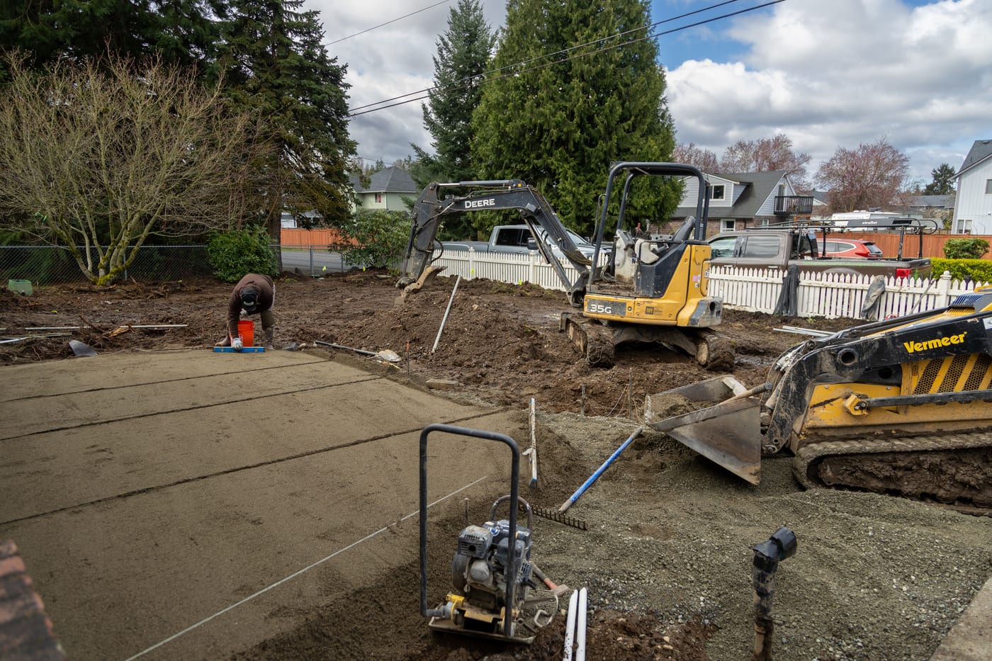 Compacting the gravel base for the new paver driveway